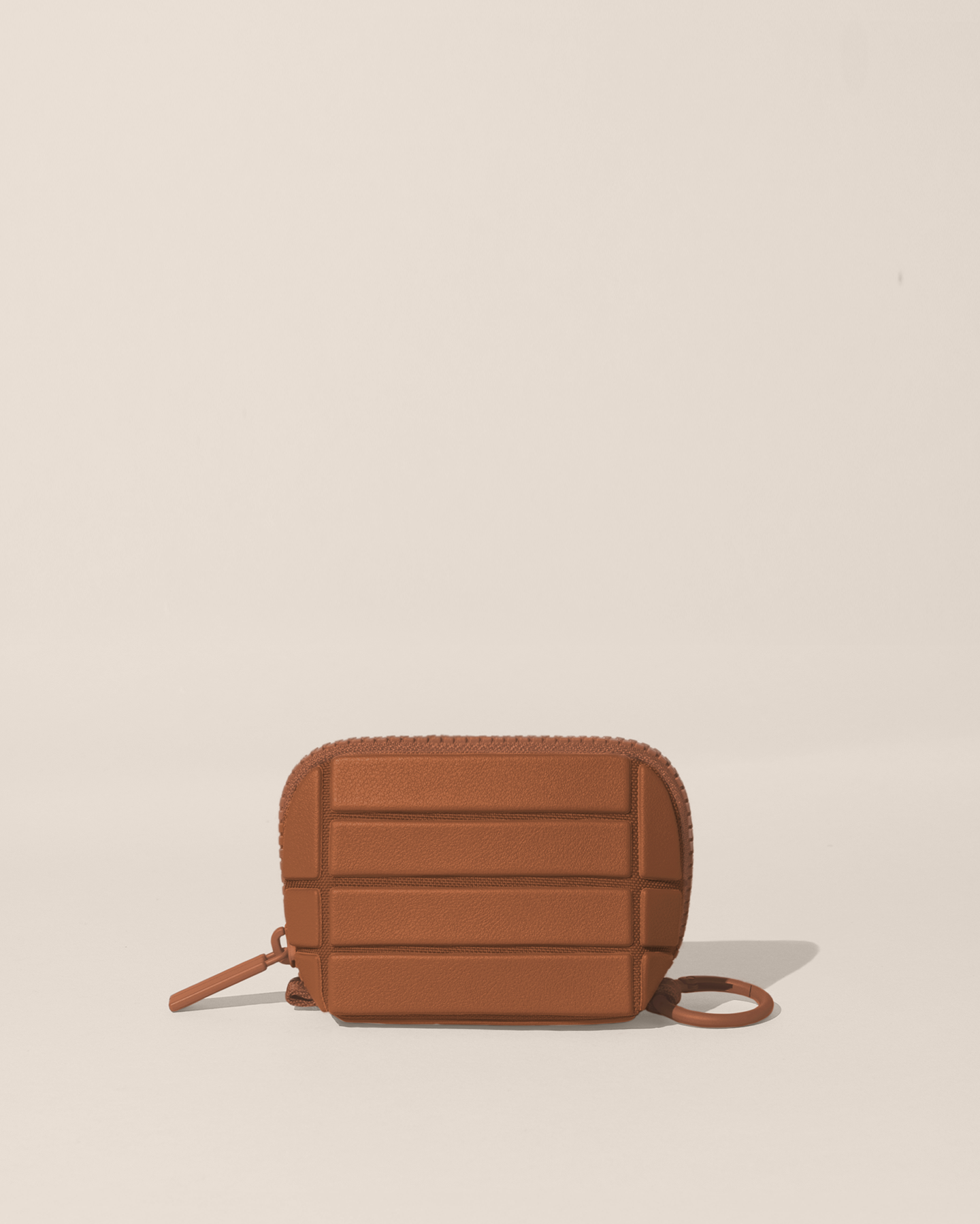 Closed Parallelle Vicuna (brown) Traveller Keychain with structured horizontal bar design shown from the front