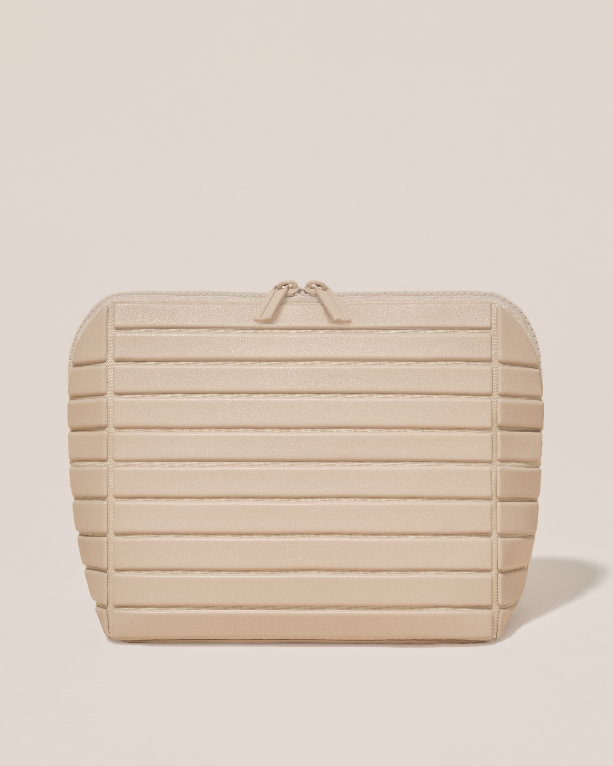 Closed Parallelle Medium Bisque (white) Traveller makeup bag with structured horizontal bar design