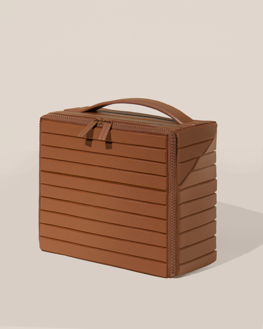 Closed Parallelle Medium Vicuna (brown) Kit toiletry bag with a compact, zip-around design and top handle for elevated everyday or travel organization