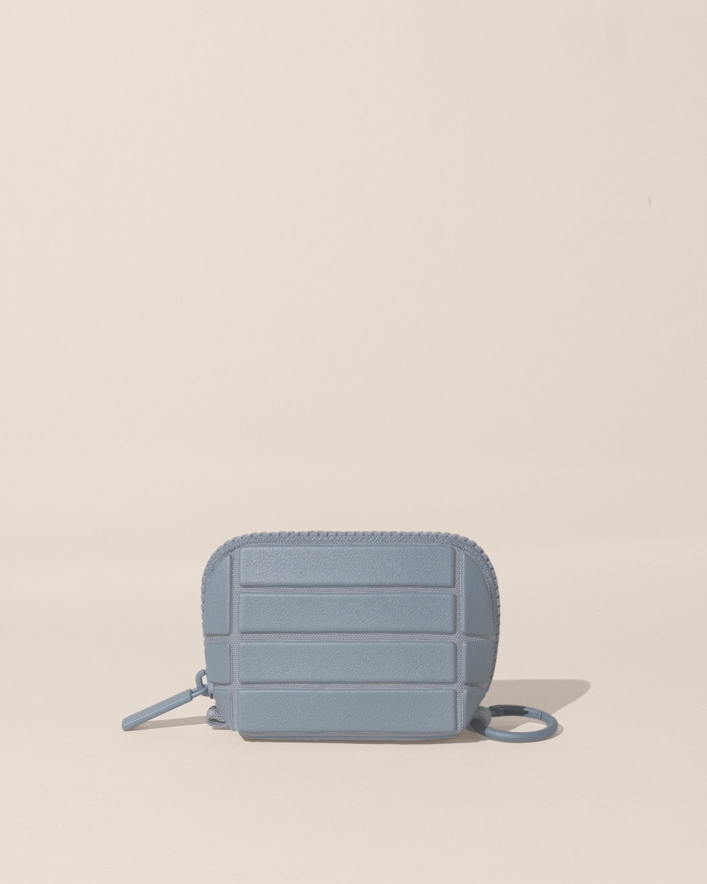 Closed Parallelle Slate (blue) Traveller Keychain with structured horizontal bar design shown from the front