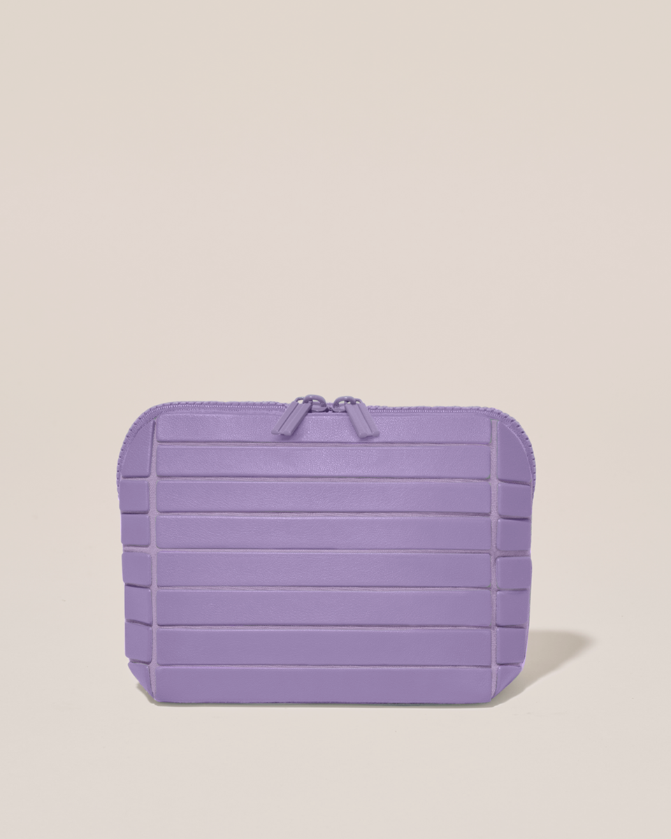 Closed Parallelle Small Lilac (purple) Traveller makeup bag with structured horizontal bar design