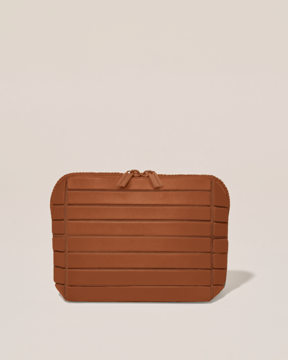 Closed Parallelle Small Vicuna (brown) Traveller makeup bag with structured horizontal bar design